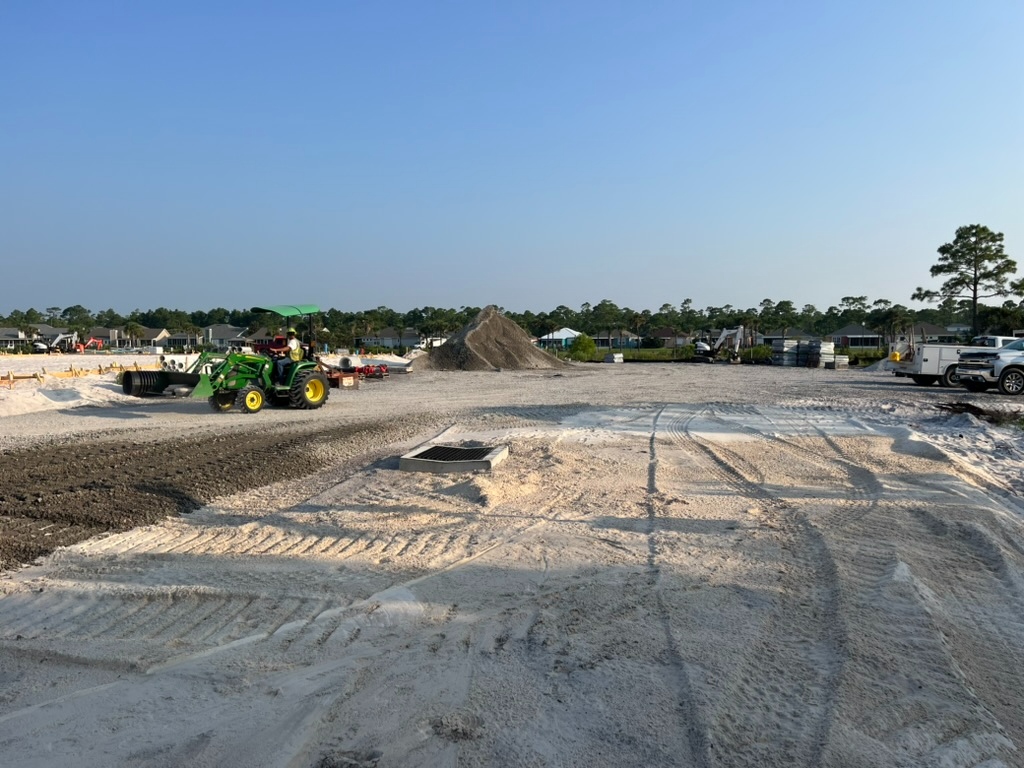 Large compacted aggregate base across a building pad ready for paving